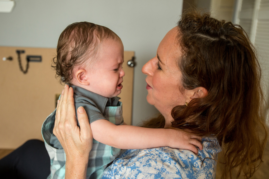 Mother soothing crying baby