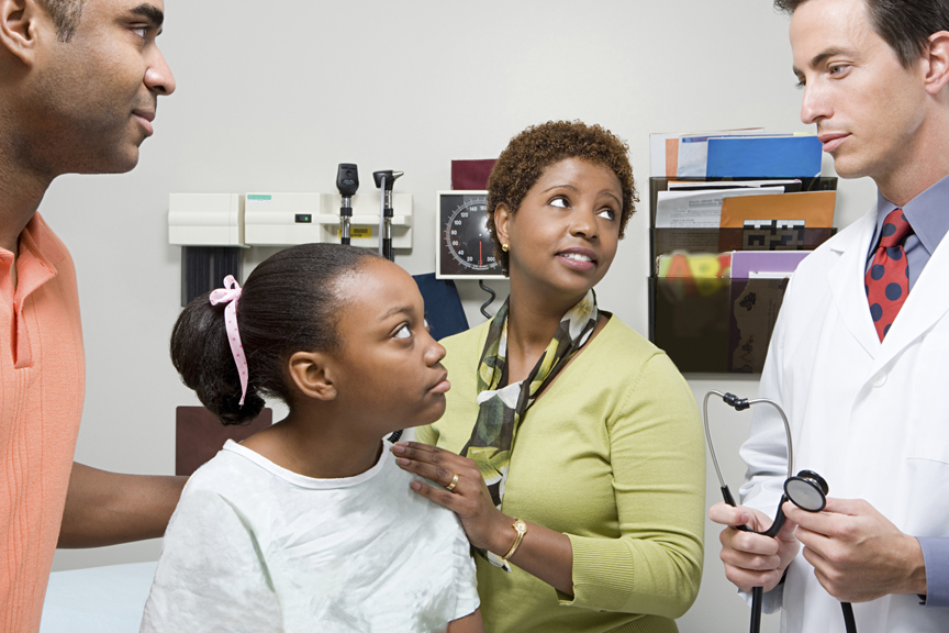 Family with girl at the doctor