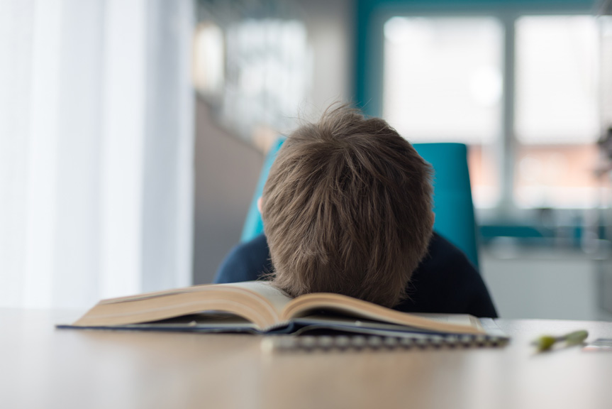 Boy frustrated at homework.